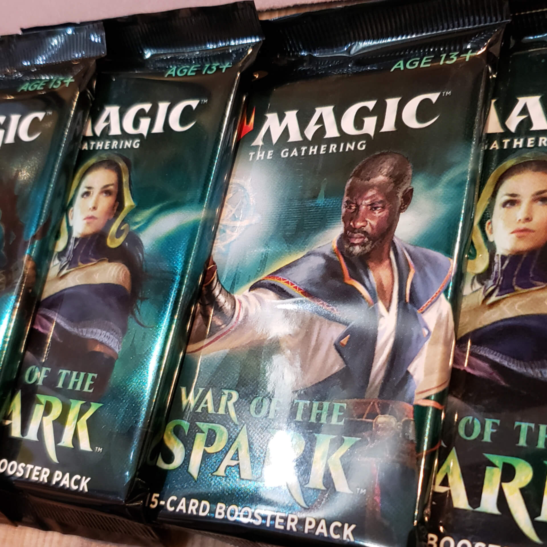 A spread of booster packs for the War of the Spark expansion.